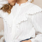 Blouse blanche élégante avec col à broderie anglaise