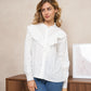 Blouse blanche élégante avec col à broderie anglaise